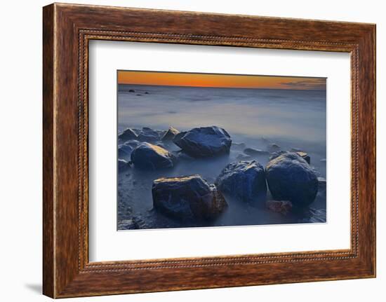 Canada, Manitoba, Winnipeg. Waves on shoreline rocks of Lake Winnipeg at dusk.-Jaynes Gallery-Framed Photographic Print