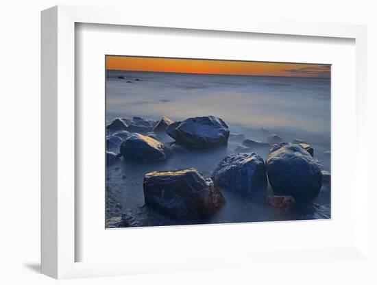 Canada, Manitoba, Winnipeg. Waves on shoreline rocks of Lake Winnipeg at dusk.-Jaynes Gallery-Framed Photographic Print