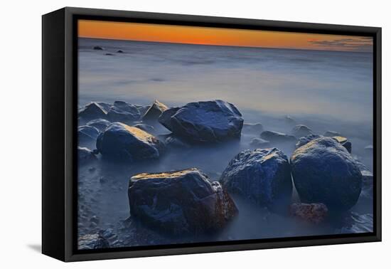 Canada, Manitoba, Winnipeg. Waves on shoreline rocks of Lake Winnipeg at dusk.-Jaynes Gallery-Framed Premier Image Canvas