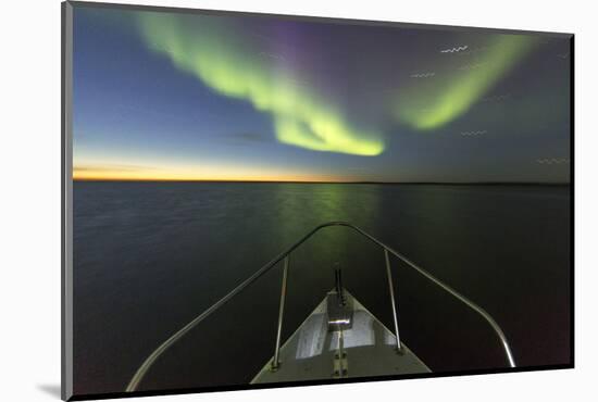 Canada, Nunavut, Aurora Borealis Glows in Night Sky Above Hudson Bay-Paul Souders-Mounted Photographic Print