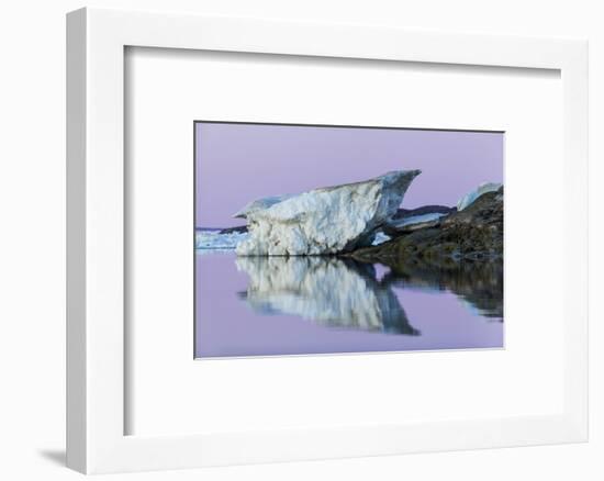 Canada, Nunavut, Iceberg Reflected in Calm Waters at Dusk-Paul Souders-Framed Photographic Print