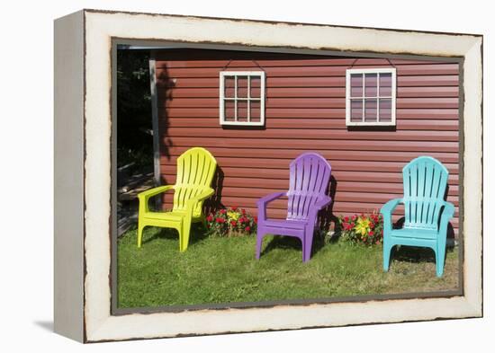 Canada, Peggy's Cove, Nova Scotia, Barn with Colorful Adirondack Chairs with Flowers-Bill Bachmann-Framed Premier Image Canvas