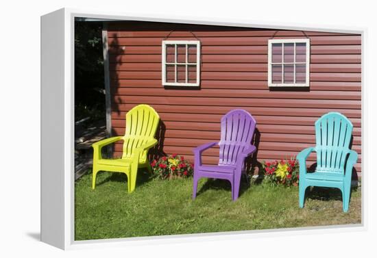 Canada, Peggy's Cove, Nova Scotia, Barn with Colorful Adirondack Chairs with Flowers-Bill Bachmann-Framed Premier Image Canvas