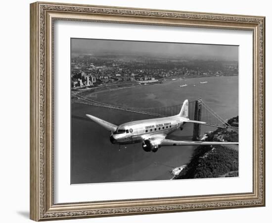 Canadian Colonial Airways Passenger Plane Flys over George Washington Bridge in Montreal, Canada-Margaret Bourke-White-Framed Photographic Print