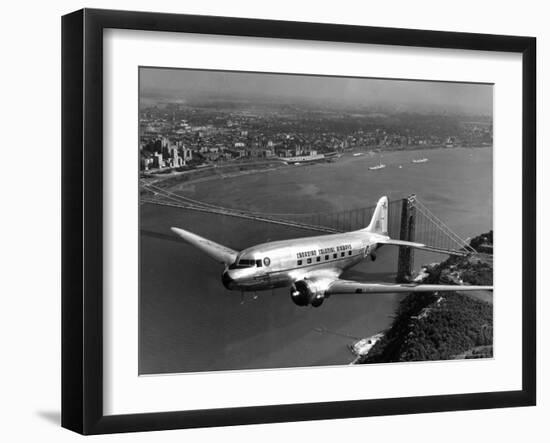 Canadian Colonial Airways Passenger Plane Flys over George Washington Bridge in Montreal, Canada-Margaret Bourke-White-Framed Photographic Print