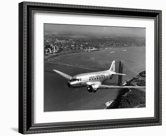 Canadian Colonial Airways Passenger Plane Flys over George Washington Bridge in Montreal, Canada-Margaret Bourke-White-Framed Photographic Print