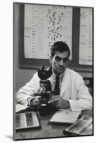 Cancer Specialist Dr. Ernest L. Wynder at Microscope in His Office, 1957-Alfred Eisenstaedt-Mounted Photographic Print