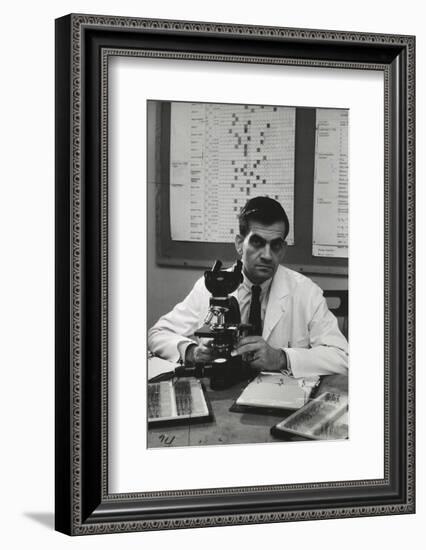 Cancer Specialist Dr. Ernest L. Wynder at Microscope in His Office, 1957-Alfred Eisenstaedt-Framed Photographic Print