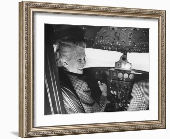 Candidate Jackie Cochran Flying Her Private Plane During Her Campaign Tour-Loomis Dean-Framed Photographic Print