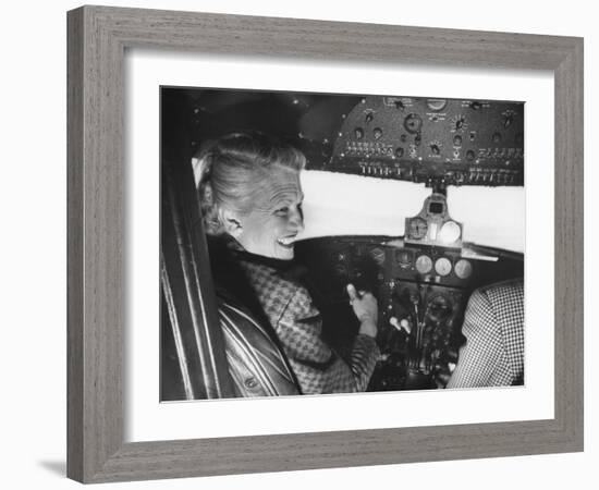 Candidate Jackie Cochran Flying Her Private Plane During Her Campaign Tour-Loomis Dean-Framed Photographic Print