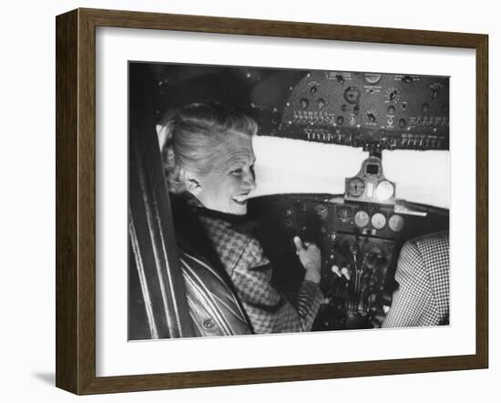 Candidate Jackie Cochran Flying Her Private Plane During Her Campaign Tour-Loomis Dean-Framed Photographic Print