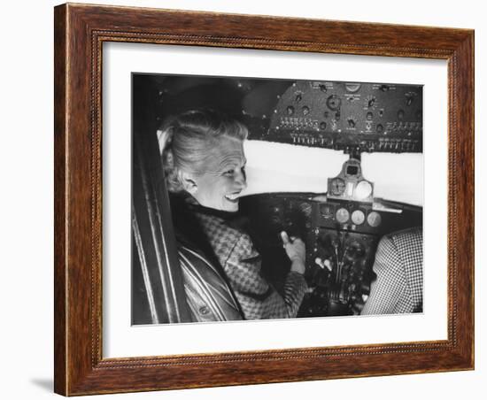 Candidate Jackie Cochran Flying Her Private Plane During Her Campaign Tour-Loomis Dean-Framed Photographic Print