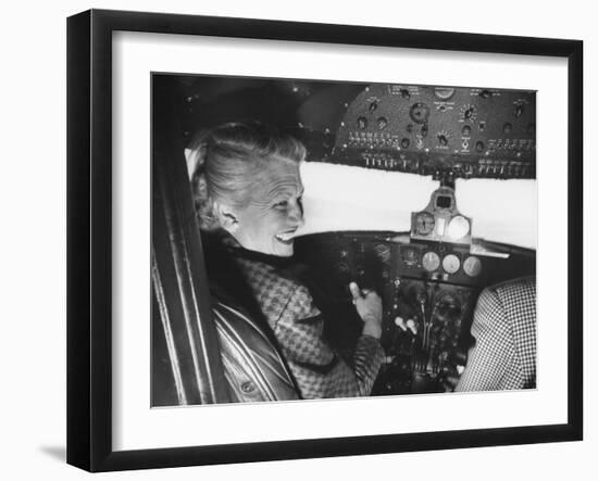 Candidate Jackie Cochran Flying Her Private Plane During Her Campaign Tour-Loomis Dean-Framed Photographic Print