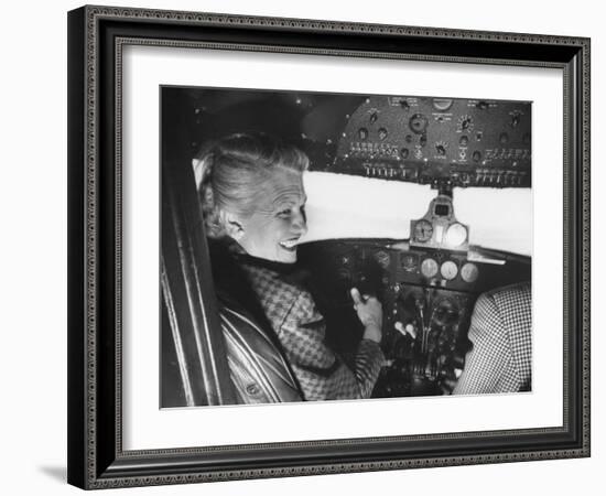 Candidate Jackie Cochran Flying Her Private Plane During Her Campaign Tour-Loomis Dean-Framed Photographic Print