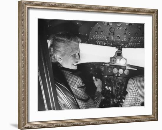 Candidate Jackie Cochran Flying Her Private Plane During Her Campaign Tour-Loomis Dean-Framed Photographic Print