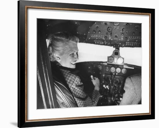 Candidate Jackie Cochran Flying Her Private Plane During Her Campaign Tour-Loomis Dean-Framed Photographic Print