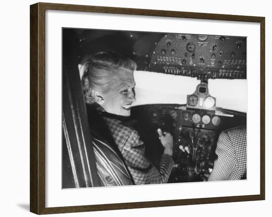 Candidate Jackie Cochran Flying Her Private Plane During Her Campaign Tour-Loomis Dean-Framed Photographic Print