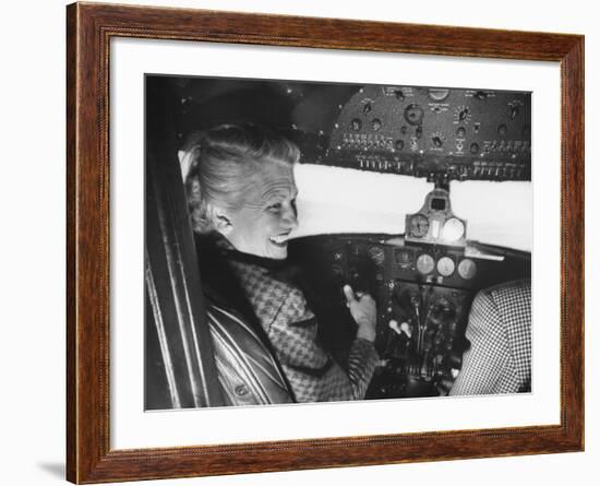 Candidate Jackie Cochran Flying Her Private Plane During Her Campaign Tour-Loomis Dean-Framed Photographic Print