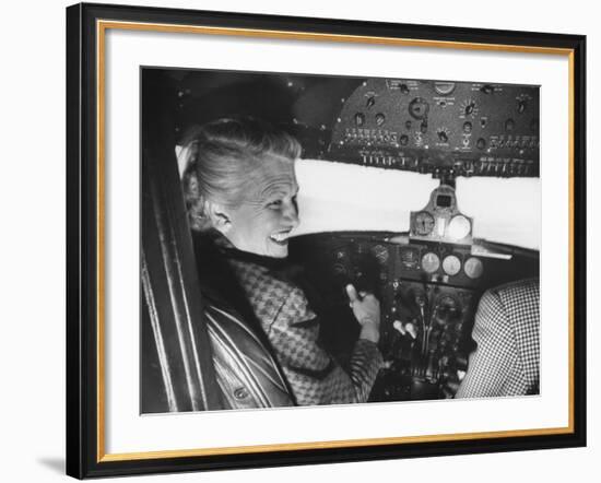 Candidate Jackie Cochran Flying Her Private Plane During Her Campaign Tour-Loomis Dean-Framed Photographic Print
