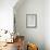 Candles in pots and heart pendant as a decoration, still life-Andrea Haase-Framed Photographic Print displayed on a wall