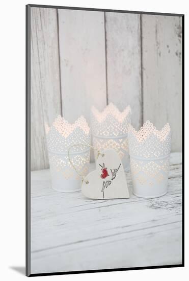 Candles in pots and heart pendant as a decoration, still life-Andrea Haase-Mounted Photographic Print