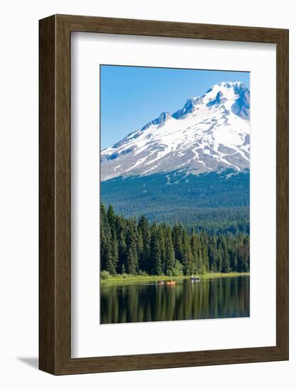Canoes and rowboat on the still waters of Trillium Lake with Mount Hood, part of the Cascade Range,-Martin Child-Framed Photographic Print