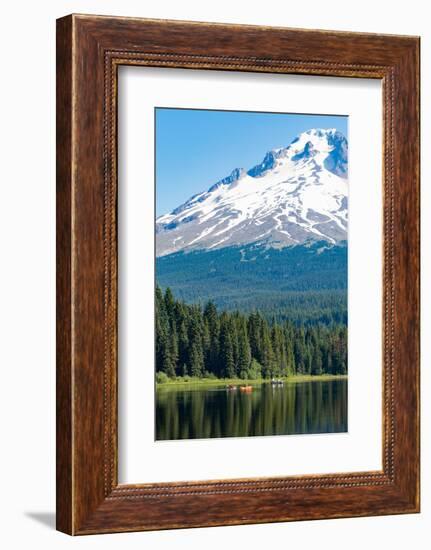 Canoes and rowboat on the still waters of Trillium Lake with Mount Hood, part of the Cascade Range,-Martin Child-Framed Photographic Print