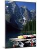 Canoes for Hire on Shore of Moraine Lake, Alberta, Canada-Ruth Tomlinson-Mounted Photographic Print