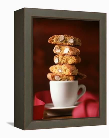 Cantucci Biscuits Piled on a Coffee Cup-Luzia Ellert-Framed Premier Image Canvas