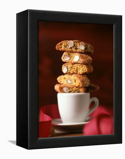 Cantucci Biscuits Piled on a Coffee Cup-Luzia Ellert-Framed Premier Image Canvas