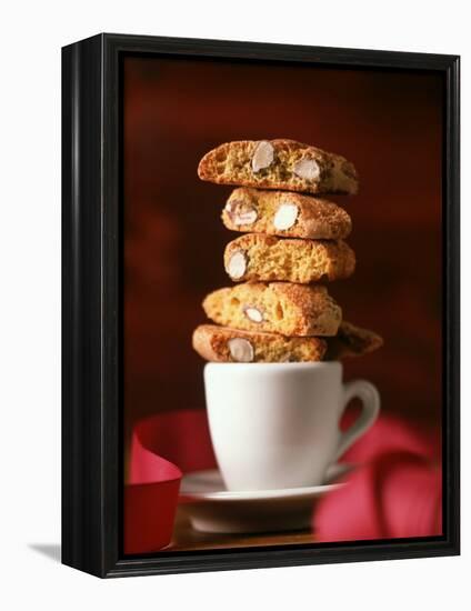 Cantucci Biscuits Piled on a Coffee Cup-Luzia Ellert-Framed Premier Image Canvas