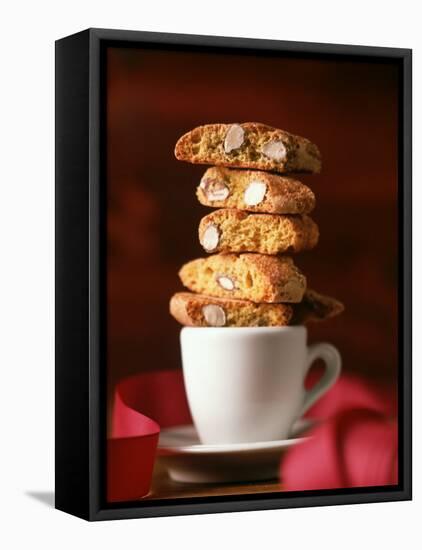 Cantucci Biscuits Piled on a Coffee Cup-Luzia Ellert-Framed Premier Image Canvas