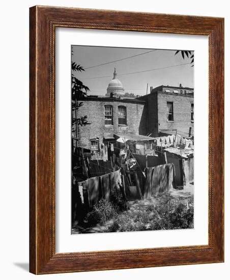 Capital Building Sitting Behind Slum Dwellings in the City-Dmitri Kessel-Framed Photographic Print