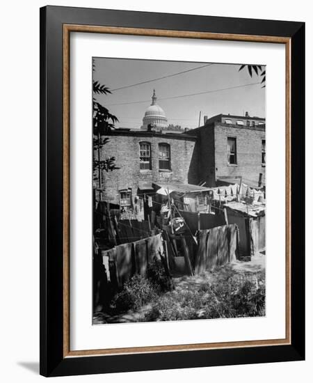 Capital Building Sitting Behind Slum Dwellings in the City-Dmitri Kessel-Framed Photographic Print