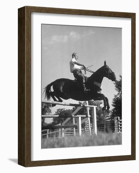 Capt. Theodore Galiza, Russian Riding Master, Taking Triple Bars, Horse Show Organized-Alfred Eisenstaedt-Framed Photographic Print