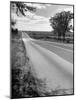 Car Driving West of Omaha on Highway 30-Allan Grant-Mounted Photographic Print