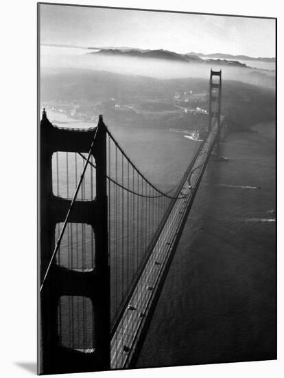 Car Lanes across the Golden Gate Bridge with Fog-Covered City of San Francisco in Background-Margaret Bourke-White-Mounted Premium Photographic Print