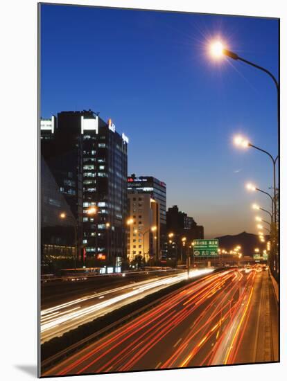 Car Light Trails and Modern Architecture on a City Ring Road, Beijing, China-Kober Christian-Mounted Photographic Print