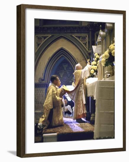 Cardinal Stritch Elevating Chalice after Transubstantiation During Mass-John Dominis-Framed Premium Photographic Print