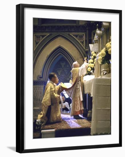 Cardinal Stritch Elevating Chalice after Transubstantiation During Mass-John Dominis-Framed Premium Photographic Print