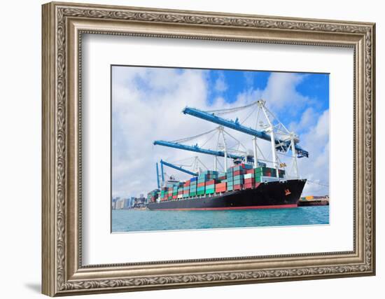 Cargo Ship at Miami Harbor with Crane and Blue Sky over Sea.-Songquan Deng-Framed Photographic Print