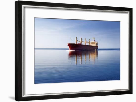 Cargo Ship Sailing in Still Water-aleksey.stemmer-Framed Photographic Print