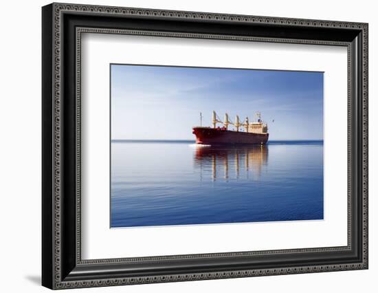 Cargo Ship Sailing in Still Water-aleksey.stemmer-Framed Photographic Print