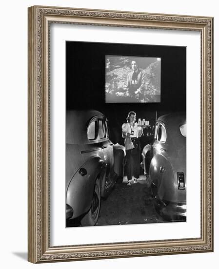 Carhop Carries Tray of Food and Drinks to Car Occupants at Drive-in Movie-Allan Grant-Framed Photographic Print