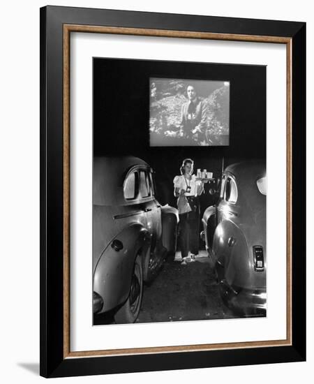 Carhop Carries Tray of Food and Drinks to Car Occupants at Drive-in Movie-Allan Grant-Framed Photographic Print