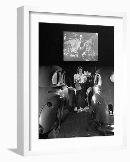 Carhop Carries Tray of Food and Drinks to Car Occupants at Drive-in Movie-Allan Grant-Framed Photographic Print