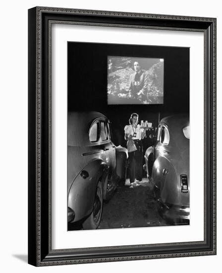 Carhop Carries Tray of Food and Drinks to Car Occupants at Drive-in Movie-Allan Grant-Framed Photographic Print