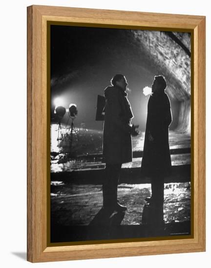 Carol Reed Coaching Orson Welles as They Stand Against Floodlights During Filming "The Third Man."-William Sumits-Framed Premier Image Canvas