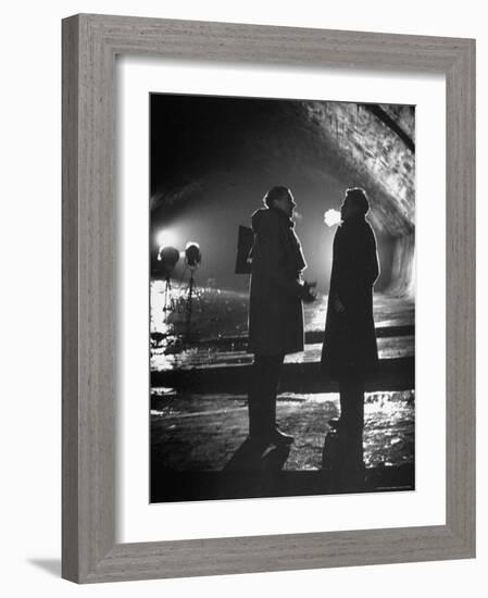Carol Reed Coaching Orson Welles as They Stand Against Floodlights During Filming "The Third Man."-William Sumits-Framed Premium Photographic Print