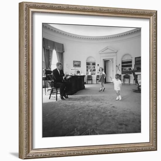 Caroline and John Jr. Dance in the Oval Office as President Kennedy Claps. 1962-null-Framed Photo